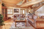 Antler Lodge - Living area with beautiful full log beams.